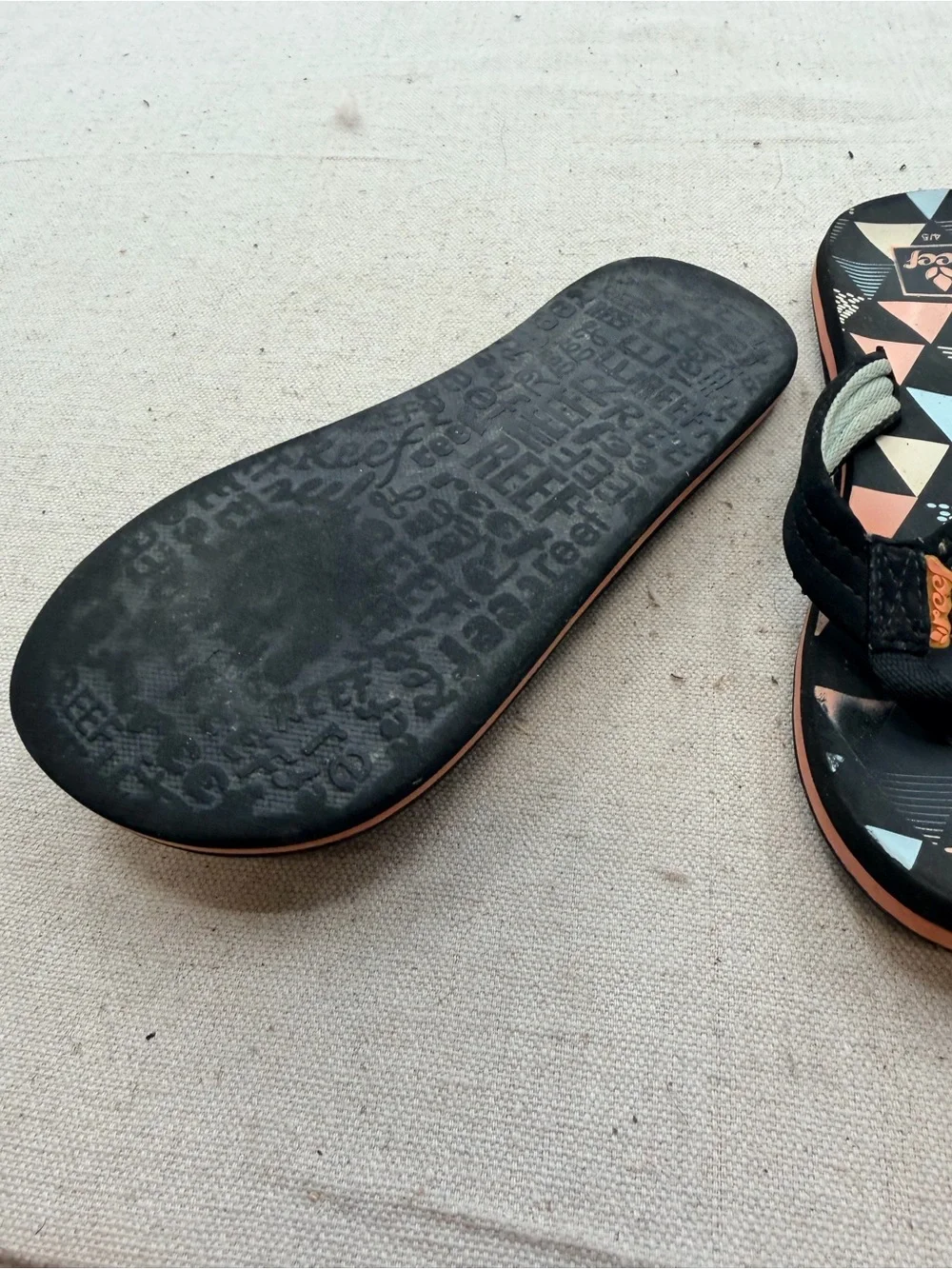 Reef Black Flip Flops with Coral & Light Blue Triangle Print